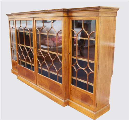 An Edwardian inlaid satinwood breakfront bookcase, W.7ft 7in. D.1ft 6in. H.4ft 3in.